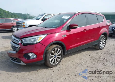 2017 Ford Escape Titanium z USA, uszkodzony, nr VIN 1FMCU9J99HUC41851